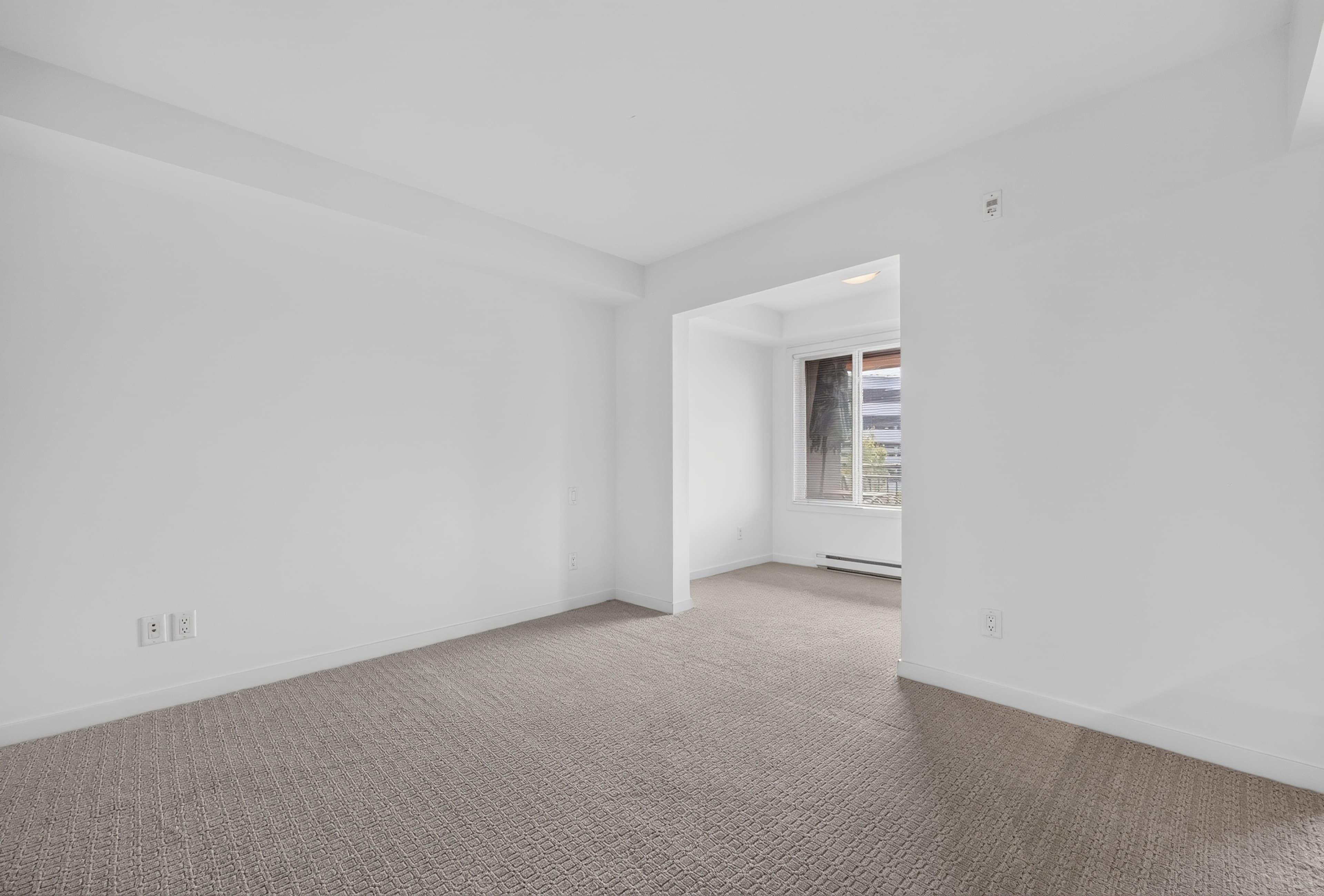 Empty open-concept living and dining room